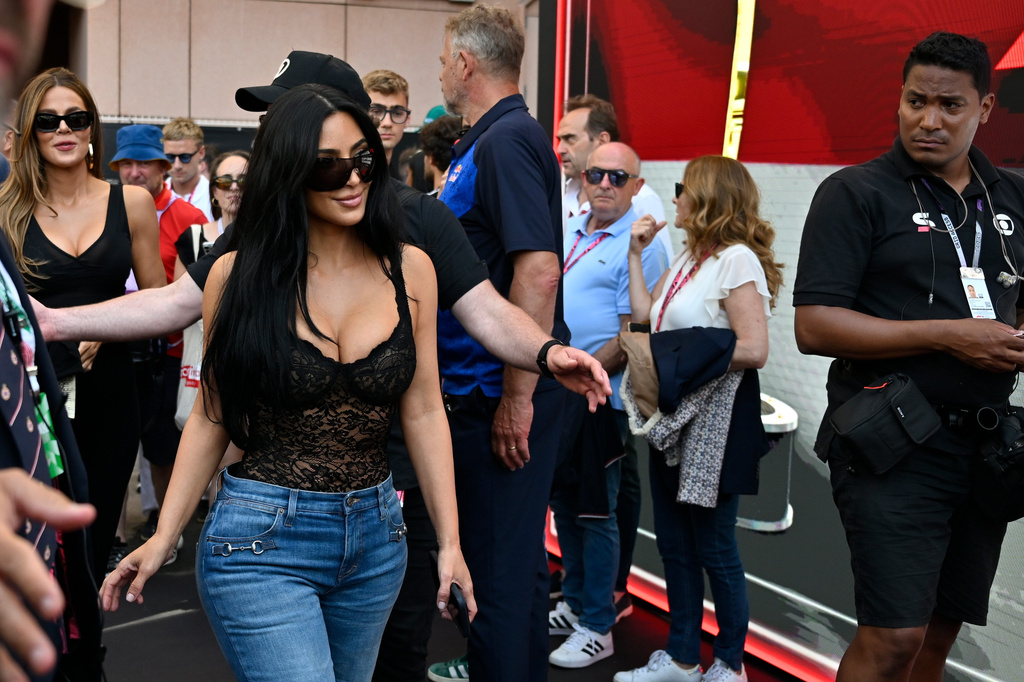 Kim Kardashian walks in the paddock the qualifying session for the Monaco F1 Grand Prix, at the Monaco racetrack, Saturday, June 6, 2026. (AP Photo/Philippe Magoni)
