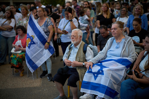 Attendees listen to a concert at a plaza known as hostages square, in Tel Aviv, Israel, Sunday, Oct. 12, 2025. (AP Photo/Emilio Morenatti) Attendees listen to a concert at a plaza known as hostages square, in Tel Aviv, Israel, Sunday, Oct. 12, 2025. (AP Photo/Emilio Morenatti)