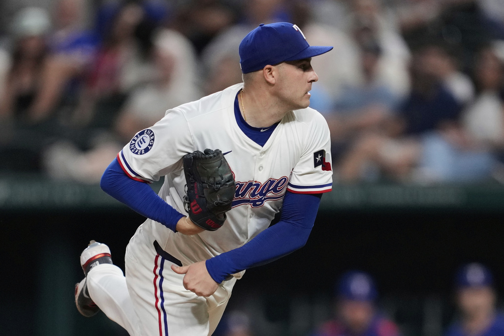 Texas Rangers starting pitcher Patrick Corbin follows through on his delivery to the Los Angeles Angels in the seventh inning of a baseball game, Tuesday, Aug. 26, 2025, in Arlington, Texas. (AP Photo/Tony Gutierrez)