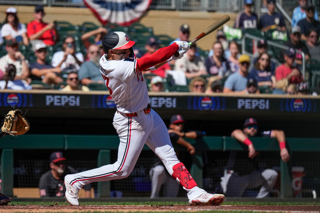 Minnesota Twins' Royce Lewis hits a flyout during the second inning of a baseball game against the Cleveland Guardians, Sunday, Sept. 13, 2026, in Minneapolis. (AP Photo/Joseph Scheller)