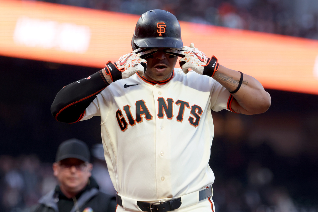 San Francisco Giants' Rafael Devers, gestures after hitting a three-run home run against the Cincinnati Reds during the second inning of a baseball game in San Francisco, Monday, Aug. 24, 2026. (AP Photo/Jed Jacobsohn)