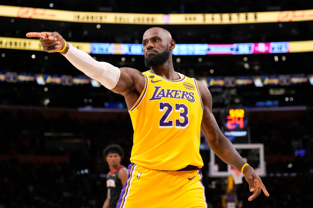 Los Angeles Lakers forward LeBron James gestures after scoring during the second half in Game 1 of a first-round NBA playoffs basketball series against the Houston Rockets, Saturday, April 18, 2026, in Los Angeles. (AP Photo/Mark J. Terrill)
