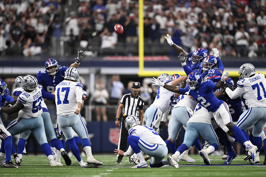 Dallas Cowboys place kicker Brandon Aubrey (17) kicks a game-tying field goal late in the second half of an NFL football game against the New York Giants Sunday, Sept. 14, 2025, in Arlington, Texas. (AP Photo/Jerome Miron)