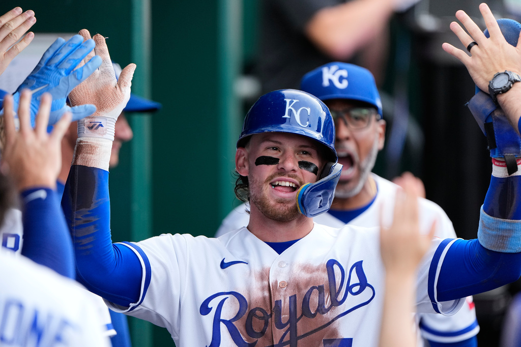 Kansas City Royals' Bobby Witt Jr. celebrates in the dugout after scoring on a double by Starling Marte during the second inning of a baseball game against the St. Louis Cardinals, Thursday, June 18, 2026, in Kansas City, Mo. (AP Photo/Charlie Riedel)