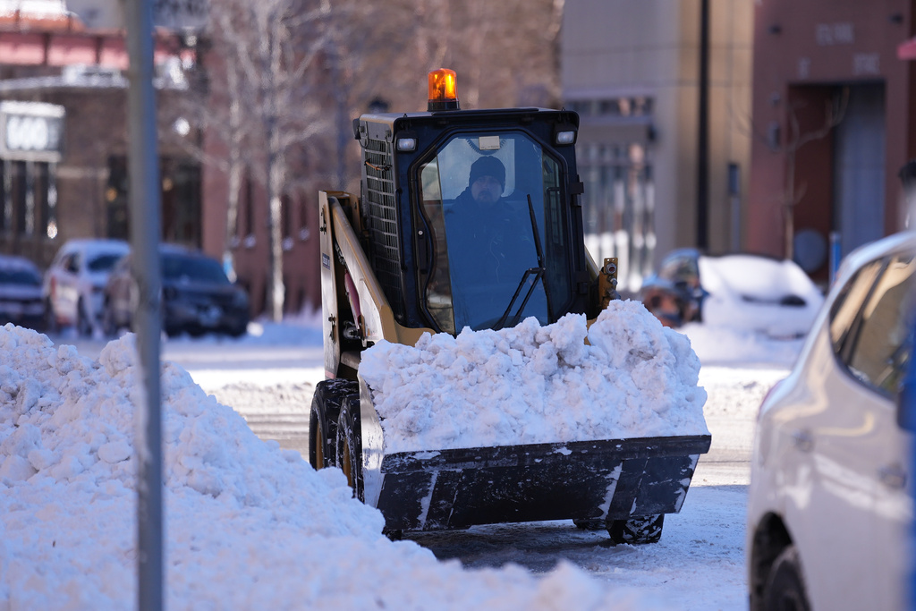 Snow is plowed after a snowstorm Monday, March 16, 2026, in Minneapolis. (AP Photo/Abbie Parr)