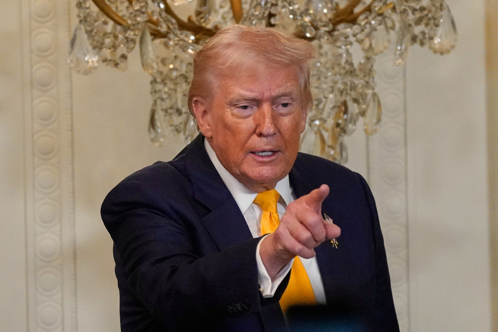 President Donald Trump gestures during a Black History Month event in the East Room of the White House, Wednesday, Feb. 18, 2026, in Washington. (AP Photo/Nathan Howard)