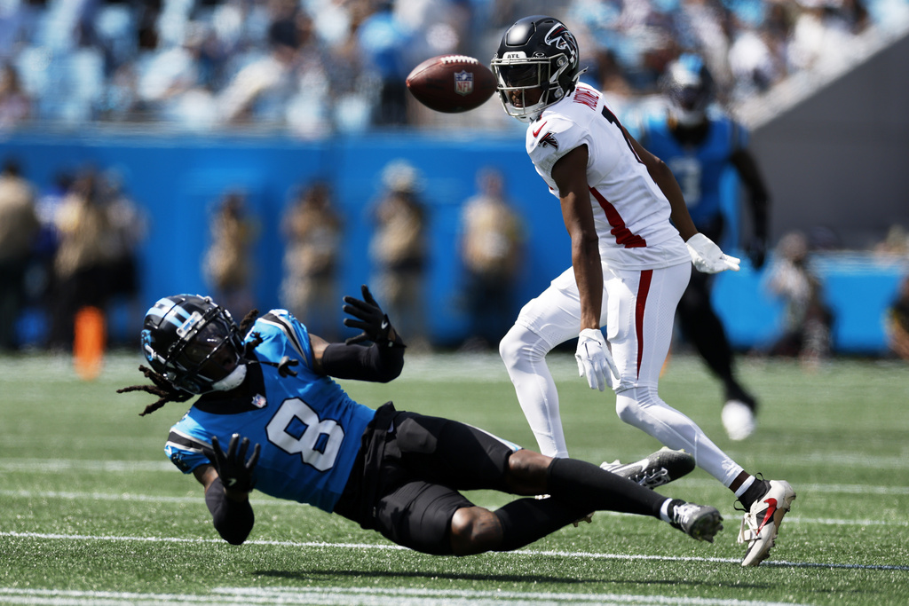 Carolina Panthers cornerback Jaycee Horn breaks up a pass intended for Atlanta Falcons wide receiver Darnell Mooney tpxduring the first half of an NFL football game, Sunday, Sept. 21, 2025, in Charlotte, N.C. (AP Photo/Rusty Jones)