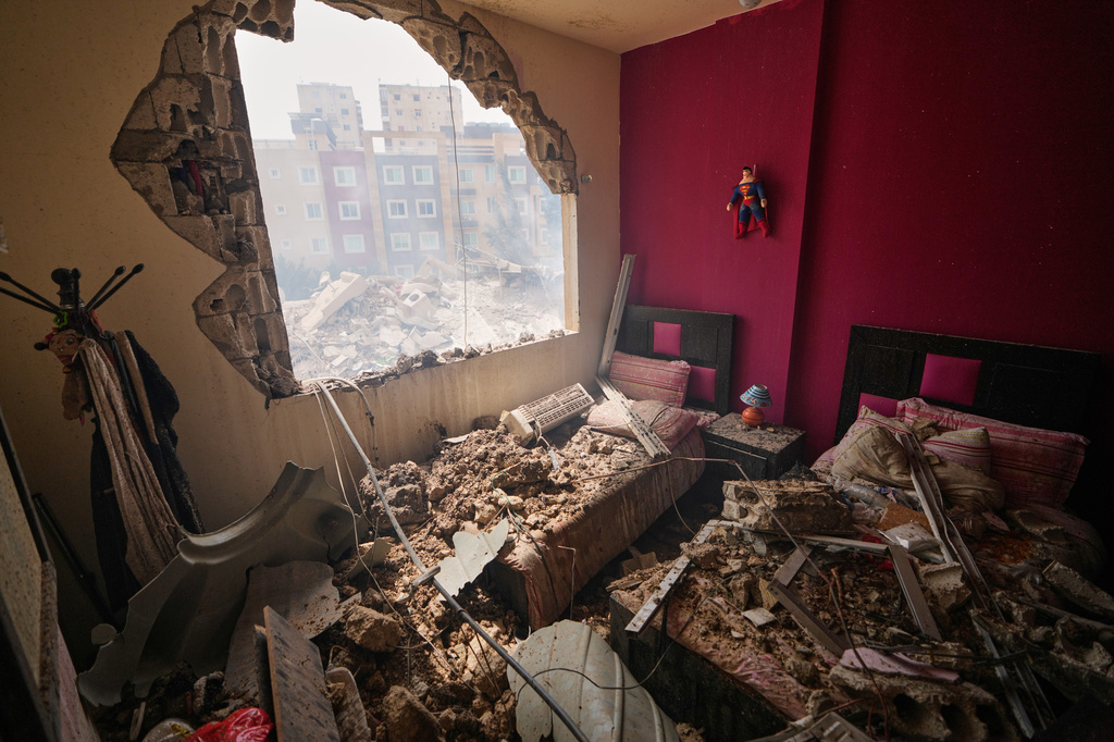 A bedroom is damaged in a building struck in an Israeli airstrike in the southern port city of Tyre, Lebanon, Saturday, April 4, 2026. (AP Photo/Mohammed Zaatari)