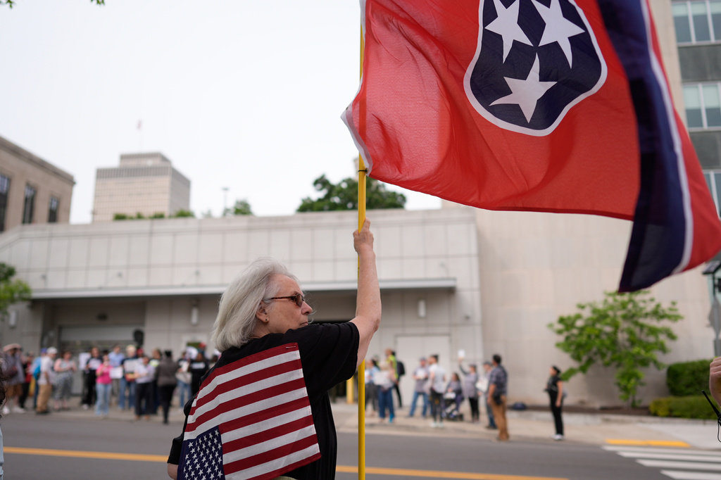 A woman protests against a special session of the state legislature to redraw U.S. Congressional voting maps Tuesday, May 5, 2026, in Nashville, Tenn. (AP Photo/George Walker IV)