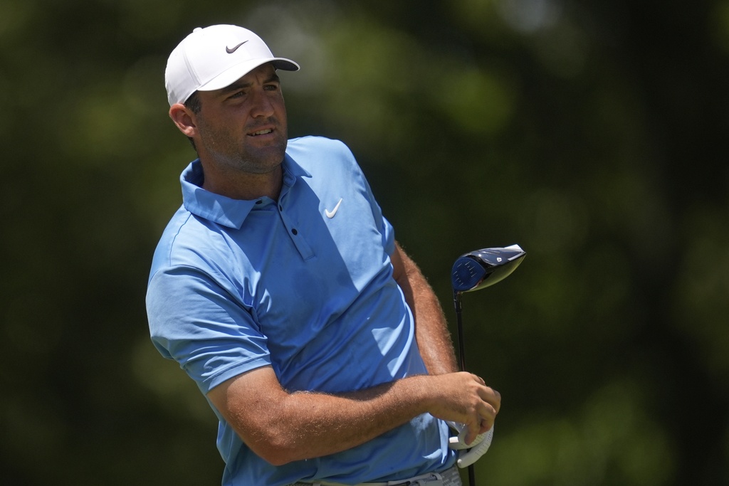 Scottie Scheffler watches his tee shot on the seventh hole during the third round of the St. Jude Championship golf tournament Saturday, Aug. 9, 2025, in Memphis, Tenn. (AP Photo/George Walker IV)