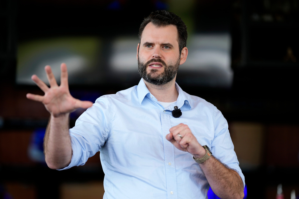 Iowa state Sen. Zach Wahls campaigns for the Democratic nomination for U.S. Senate during an event with local residents, Saturday, May 23, 2026, in Waukee, Iowa. (AP Photo/Charlie Neibergall)