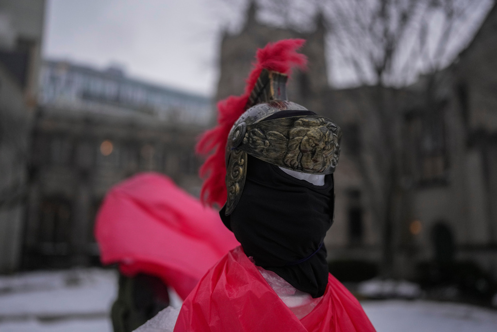 A mannequin representing a Roman solider wears a mask in the Nativity scene outside of Lake Street Church of Evanston, Wednesday, Dec. 10, 2025, in Evanston, Ill. (AP Photo/Erin Hooley)