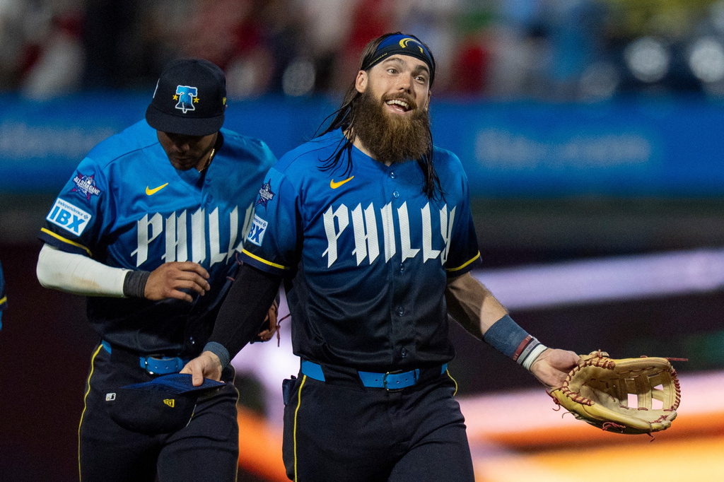 Philadelphia Phillies' Brandon Marsh, right, reacts after a baseball game against the Chicago White Sox, Friday, June 5, 2026, in Philadelphia. (AP Photo/Chris Szagola)