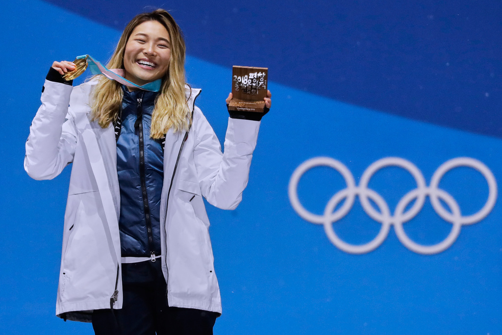 FILE - Women's halfpipe gold medalist Chloe Kim, of the United States, poses during the medals ceremony at the 2018 Winter Olympics in Pyeongchang, South Korea, on Feb. 13, 2018. (AP Photo/Morry Gash, File)