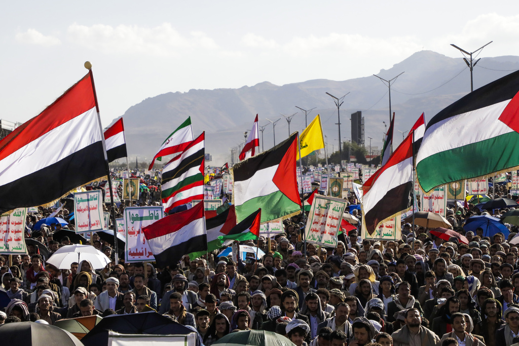 Houthi supporters wave Palestinian and Yemeni flags during an anti-Israel rally in Sanaa, Yemen, Friday, Jan. 10, 2025. (AP Photo/Osamah Abdulrahman)