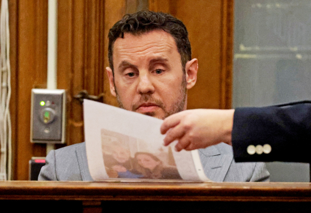 William Fastow, Ana Walshe's boyfriend, looks at a picture of Ana while on the witness stand during Brian Walshe's trial for murdering his wife Ana, Thursday, Dec. 4, 2025, in Dedham, Mass. (Matt Stone/The Boston Herald via AP, Pool)