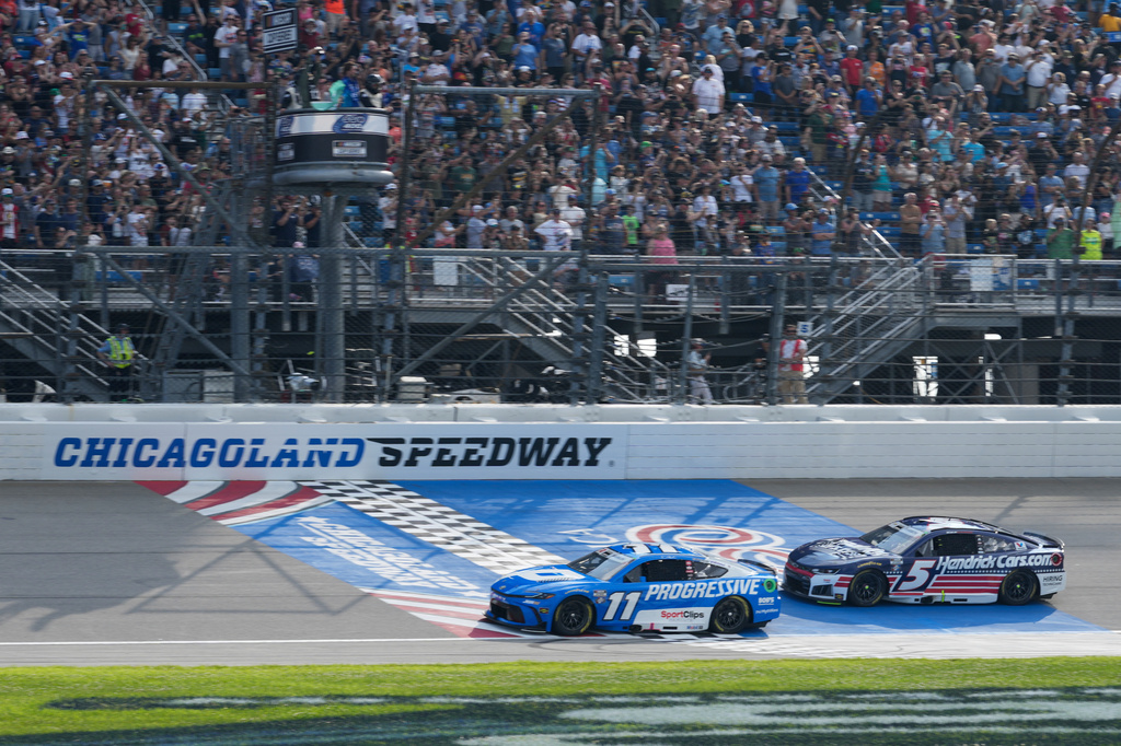 Denny Hamlin (11) and Kyle Larson (5) compete during a NASCAR Cup Series auto race at Chicagoland Speedway in Joliet, Ill., Sunday, July 5, 2026. (AP Photo/Nam Y. Huh)