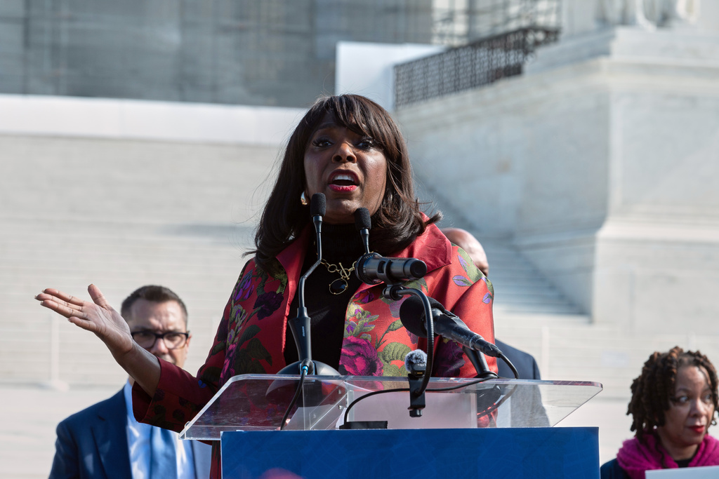 Rep. Terri Sewell, D-Ala., speaks with demonstrators in front of the Supreme Court as the court hears the case drawing new congressional district boundaries in Louisiana, in Washington, Wednesday, Oct. 15, 2025. (AP Photo/Cliff Owen)