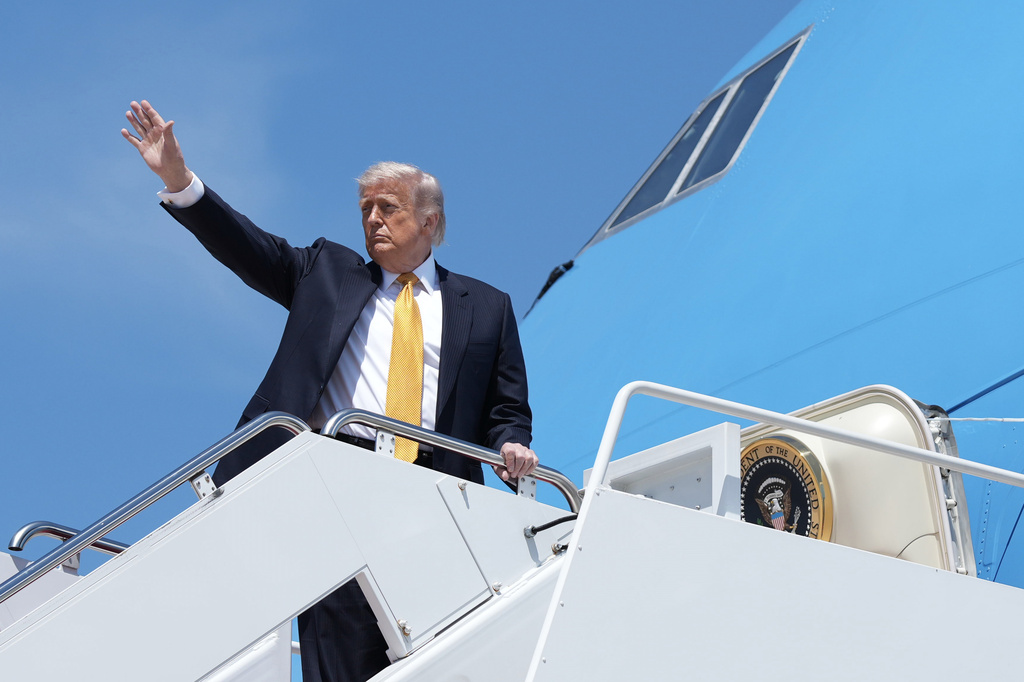 President Donald Trump boards Air Force One Tuesday, May 12, 2026, at Joint Base Andrews, Md., for a trip to China. (AP Photo/Mark Schiefelbein)