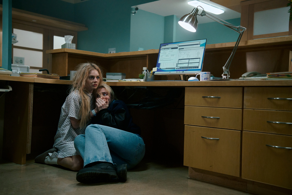 This image released by Searchlight Pictures shows Samara Weaving, left, and Kathryn Newton in a scene from "Ready or Not 2: Here I Come." (Pief Weyman/Searchlight Pictures via AP)