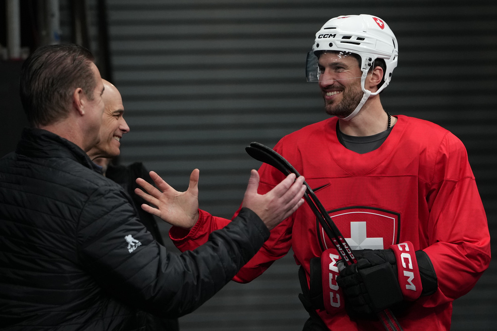 Switzerland's Roman Josi arrives for men's ice hockey practice at the 2026 Winter Olympics, in Milan, Italy, Sunday, Feb. 8, 2026. (AP Photo/Carolyn Kaster)