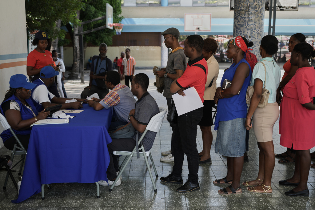 Haitians register to vote in the upcoming general election in Port-au-Prince, Haiti, Friday, July 31, 2026. (AP Photo/Odelyn Joseph)