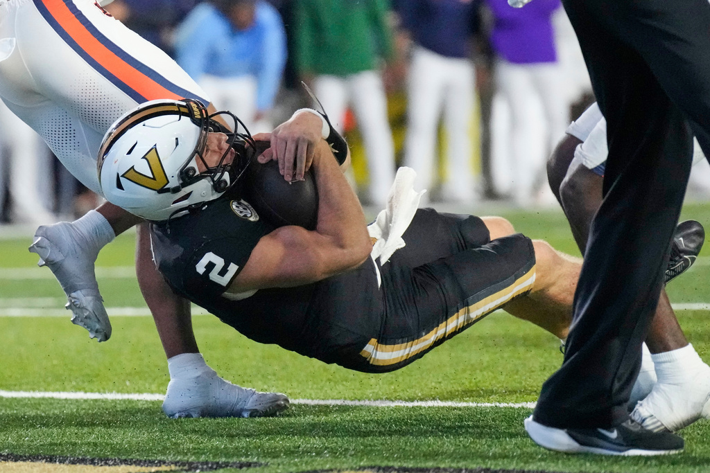 Vanderbilt quarterback Diego Pavia (2) scores a touchdown during the second half of an NCAA college football game against Auburn, Saturday, Nov. 8, 2025, in Nashville, Tenn. (AP Photo/George Walker IV)