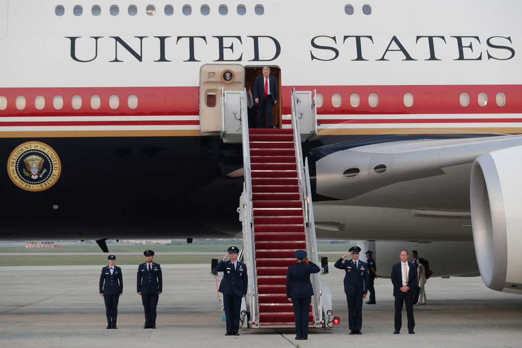 President Donald Trump walks down the stairs of Air Force One upon his arrival at Joint Base Andrews, Md., Sunday, July 19, 2026. (AP Photo/Luis M. Alvarez)