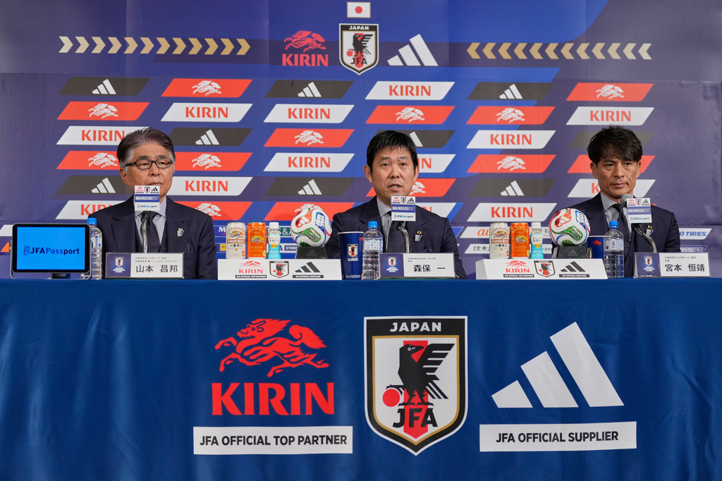 Hajime Moriyasu, center, head coach of Japan's national soccer team, accompanying Masakuni Yamamoto, left, national team director, and Tsuneyasu Miyamoto, right, president of the Japan Football Association, announces Japan's squad for the 2026 FIFA World Cup during a news conference Friday, May 15, 2026, in Tokyo. (AP Photo/Eugene Hoshiko)