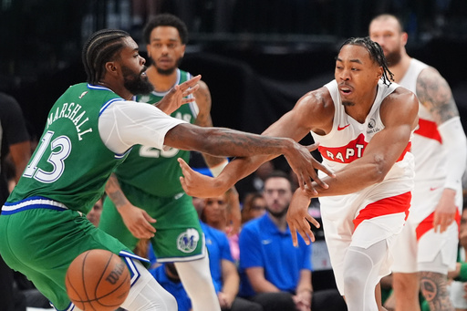 Toronto Raptors forward Scottie Barnes, right, passes the ball against Dallas Mavericks forward Naji Marshall (13) during the first half of an NBA basketball game basketball game in Dallas, Sunday, Oct. 26, 2025. (AP Photo/LM Otero) Toronto Raptors forward Scottie Barnes, right, passes the ball against Dallas Mavericks forward Naji Marshall (13) during the first half of an NBA basketball game basketball game in Dallas, Sunday, Oct. 26, 2025. (AP Photo/LM Otero)