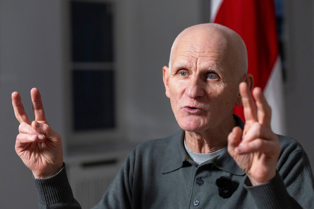Nobel Peace Prize laureate Ales Bialiatski, one of the Belarusian prisoners released on Saturday, gestures during an interview with the Associated Press in Vilnius, Lithuania, on Sunday, Dec. 14, 2025. (AP Photo/Mindaugas Kulbis)