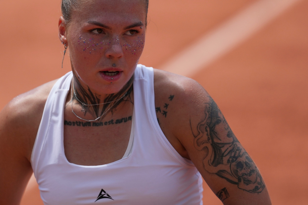 Oleksandra Oliynykova of Ukraine reacts as she plays against Diana Shnaider of Russia during their third round women's singles tennis match at the French Open tennis tournament in Paris, Saturday, May 30, 2026. (AP Photo/Thibault Camus)