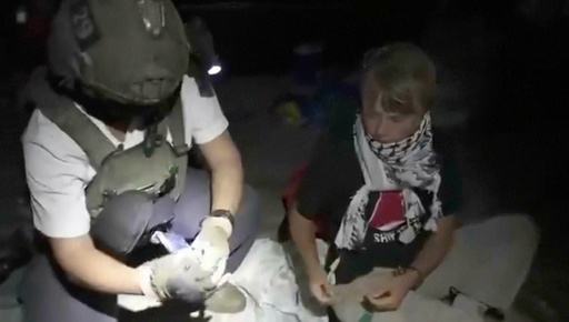 This image taken from video released by the Israeli Foreign Ministry claims to show activist Greta Thunberg, right, as she is removed after the Israeli navy intercepted the Global Sumud Flotilla carrying humanitarian aid towards Gaza on Wednesday, Oct. 1, 2025. (Israeli Foreign Ministry via AP) This image taken from video released by the Israeli Foreign Ministry claims to show activist Greta Thunberg, right, as she is removed after the Israeli navy intercepted the Global Sumud Flotilla carrying humanitarian aid towards Gaza on Wednesday, Oct. 1, 2025. (Israeli Foreign Ministry via AP)