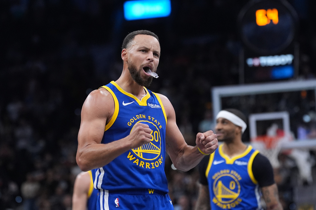 Golden State Warriors guard Stephen Curry (30) reacts after making a free-throw for the team's win over the San Antonio Spurs in an NBA Cup basketball game in San Antonio, Friday, Nov. 14, 2025. (AP Photo/Eric Gay)