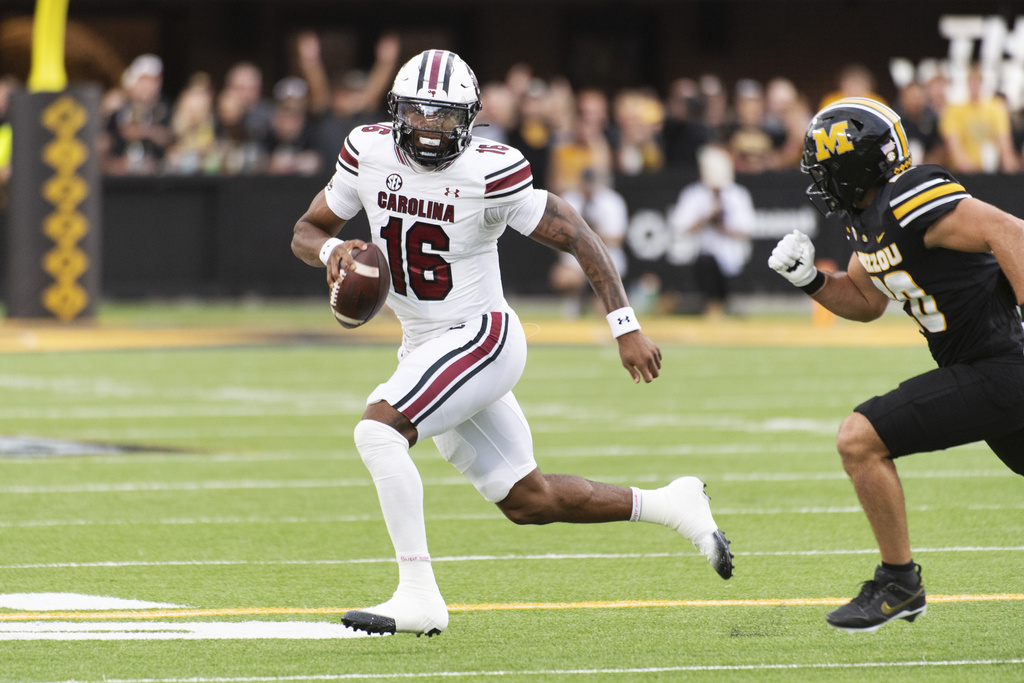 South Carolina quarterback LaNorris Sellers (16) runs past Missouri's Nicholas Rodriguez, right, during the first half of an NCAA college football game Saturday, Sept. 20, 2025, in Columbia, Mo. (AP Photo/L.G. Patterson)