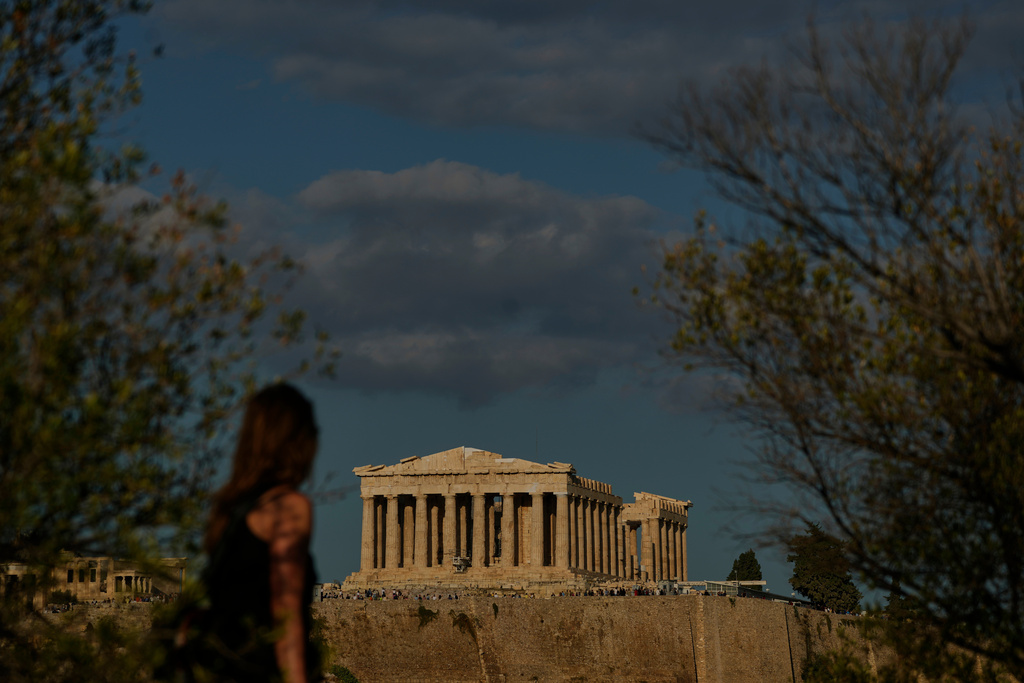 The 5th century B.C. Parthenon temple stands free of scaffolding on the Acropolis hill in Athens, Friday, Oct. 10, 2025, after the removal of restoration structures that had covered parts of the ancient monument for decades.(AP Photo/Petros Giannakouris)