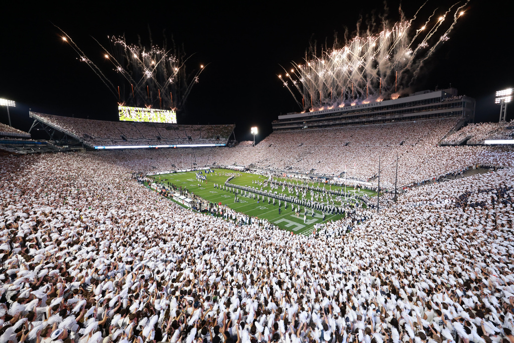 Penn State players run on to the field before an NCAA college football game against Oregon, Saturday, Sept. 27, 2025, in State College, Pa. (AP Photo/Jared Freed)
