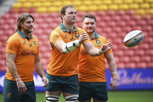 Australian rugby union players Fraser McReight, left, captain Harry Wilson and Matt Faessler, right, go through a drill during their captain's run in Brisbane, Friday, July 18, 2025, ahead of the first match of a 3-test series agains the British & Irish Lions. (Jono Searle/AAP Image via AP)