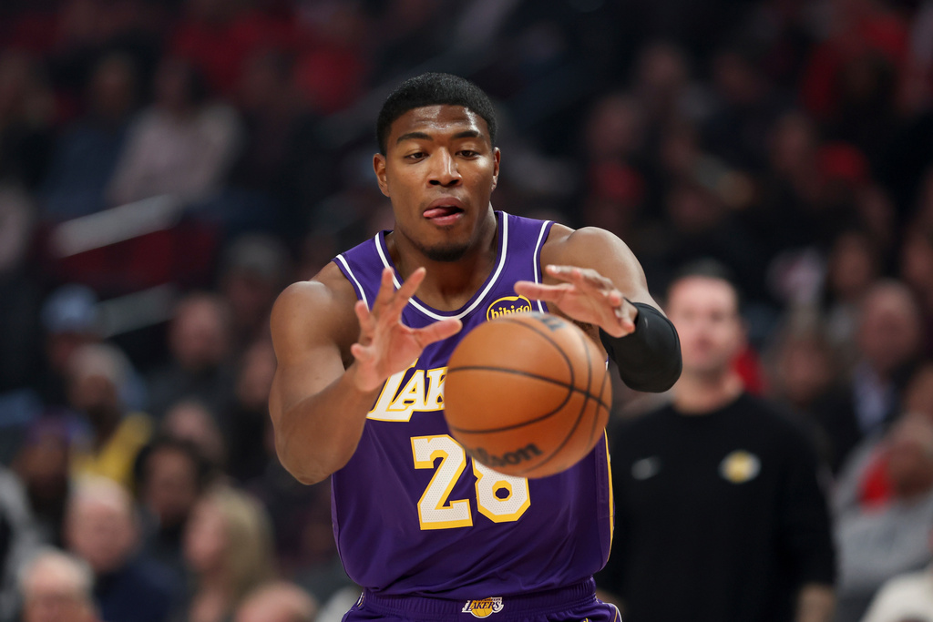 Los Angeles Lakers forward Rui Hachimura catches a pass during the first half of an NBA basketball game against the Portland Trail Blazers, Monday, Nov. 3, 2025, in Portland, Ore. (AP Photo/Amanda Loman)