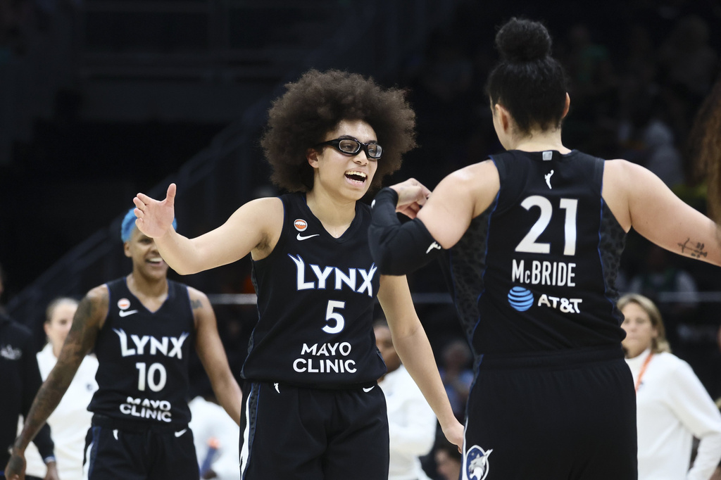 Minnesota Lynx guard Courtney Williams, left to right, Minnesota Lynx guard Olivia Miles and Minnesota Lynx guard Kayla McBride celebrate a run and timeout during a WNBA basketball game in Seattle, Wednesday, July 22, 2026.(Kevin Clark/The Seattle Times via AP)