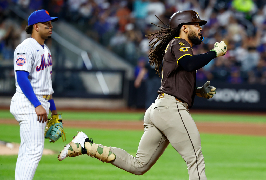 San Diego Padres' Fernando Tatis Jr. reacts after hitting a two run home run against the New York Mets during the fifth inning of a baseball game, Tuesday, Aug. 18, 2026, in New York. (AP Photo/Noah K. Murray)