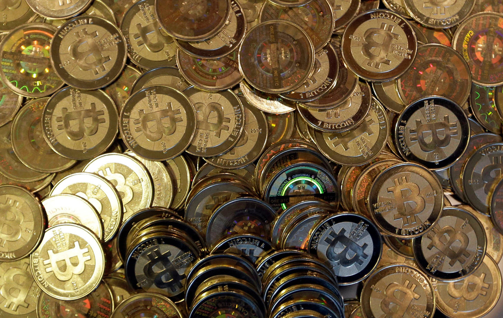 FILE - Bitcoin tokens are seen on April 3, 2013, in Sandy, Utah. (AP Photo/Rick Bowmer, File)