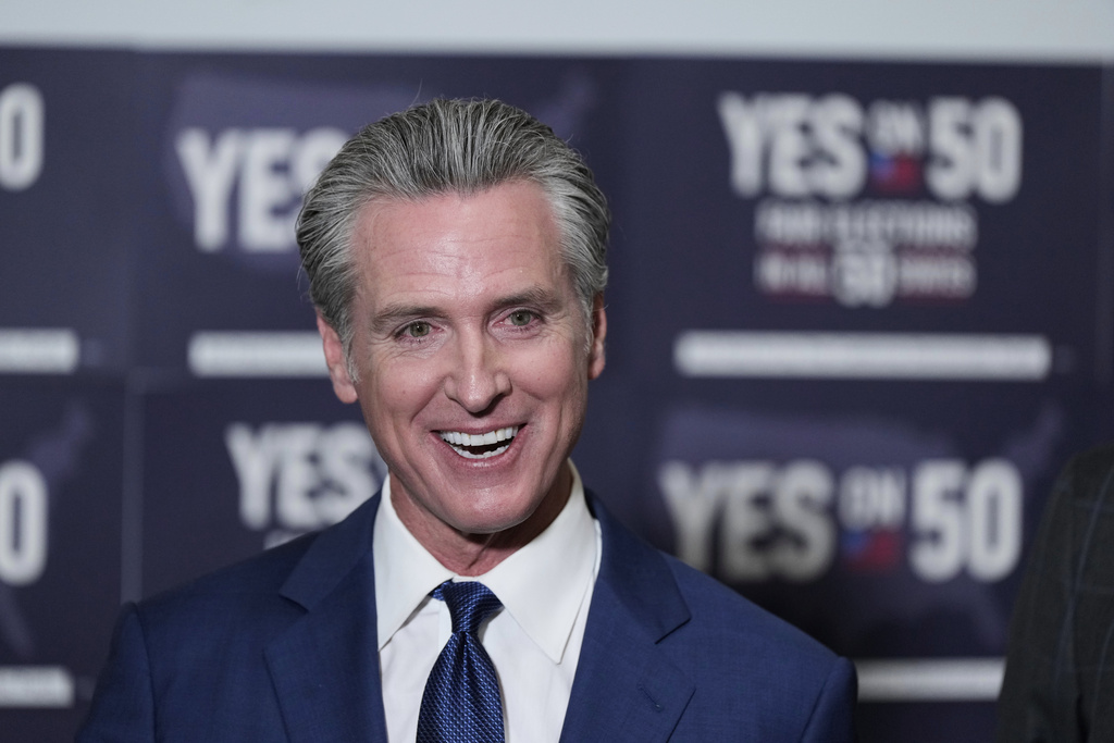 California Gov. Gavin Newsom answers questions after signing legislation calling for a special election on a redrawn congressional map on Thursday, Aug. 21, 2025, in Sacramento, Calif. (AP Photo/Godofredo A. Vásquez)