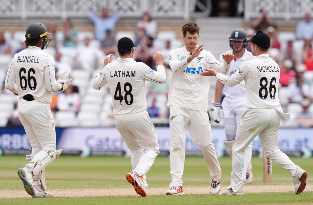 New Zealand's Mitch Santner (second right) celebrates with team-mates after taking the wicket of England's Gus Atkinson on day five of the Third Cricket Test at Trent Bridge Cricket Ground, Nottingham, England, Monday June 29, 2026. (Jacob King/PA via AP)