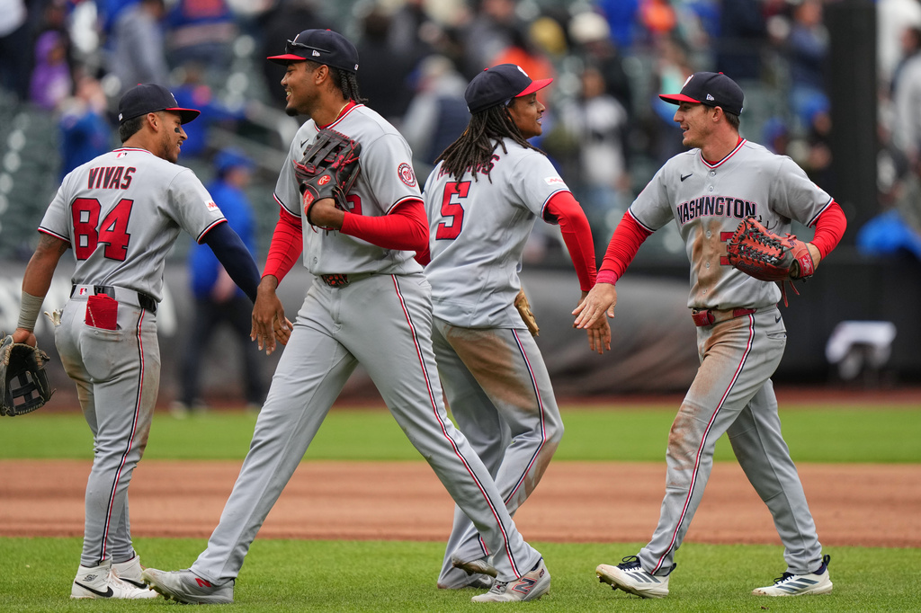 Washington Nationals' Jorbit Vivas (84) and CJ Abrams (5) celebrates with James Wood and Jacob Young after a baseball game against the New York Mets Thursday, April 30, 2026, in New York. (AP Photo/Frank Franklin II)