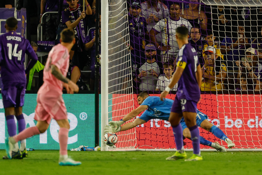 Inter Miami CF forward Lionel Messi, front left, watches as his penalty kick bends into the bottom corner of the goal against Orlando City SC goalkeeper Maxime Crépeau, back right, during the second half of an MLS soccer match, Sunday, March 1, 2026, in Orlando, Fla. (AP Photo/Kevin Kolczynski)