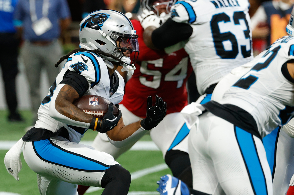 Carolina Panthers running back Jonathon Brooks (25) rushes the ball during an NFL football game against the Atlanta Falcons in Atlanta, Sunday, Sept. 20, 2026. (AP Photo/Erik S. Lesser)