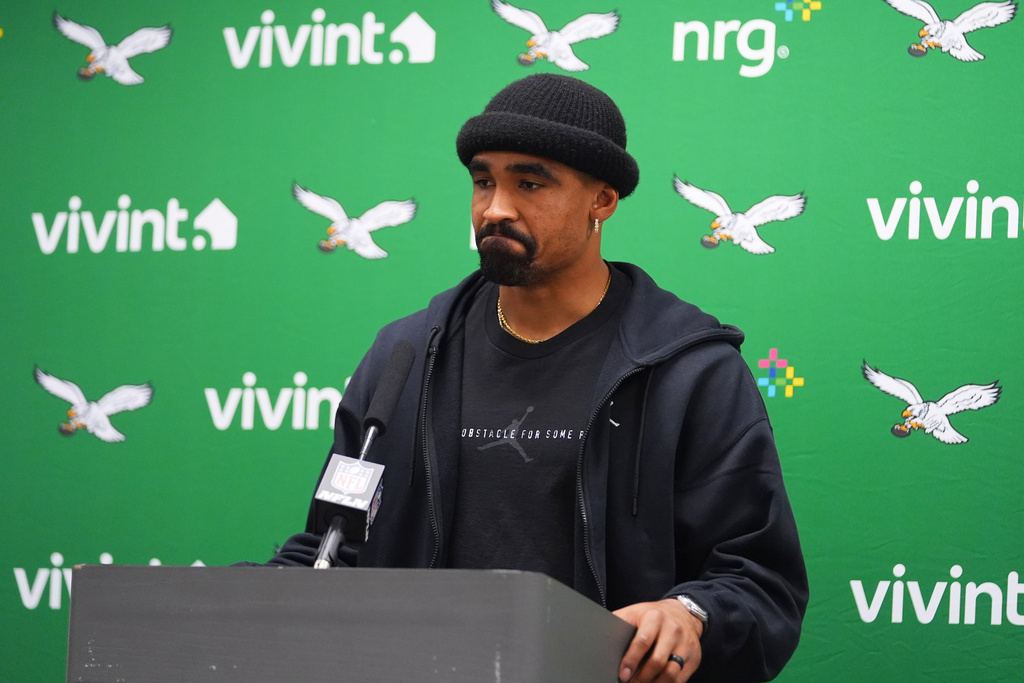 Philadelphia Eagles quarterback Jalen Hurts answers questions after an NFL football game against the Dallas Cowboys, Sunday, Nov. 23, 2025, in Arlington, Texas. (AP Photo/Julio Cortez)