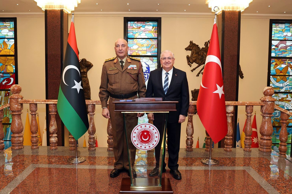 In this photo released by the Turkish Defense Ministry, Turkey's Chief of General Staff Gen. Selcuk Bayraktaroglu, right, poses for a photograph with Libyan Chief of General Staff Gen. Mohamed Ali Ahmed El Haddad during their meeting in Ankara, Turkey, Tuesday, Dec. 23, 2025. (Turkish Defense Ministry via AP)
