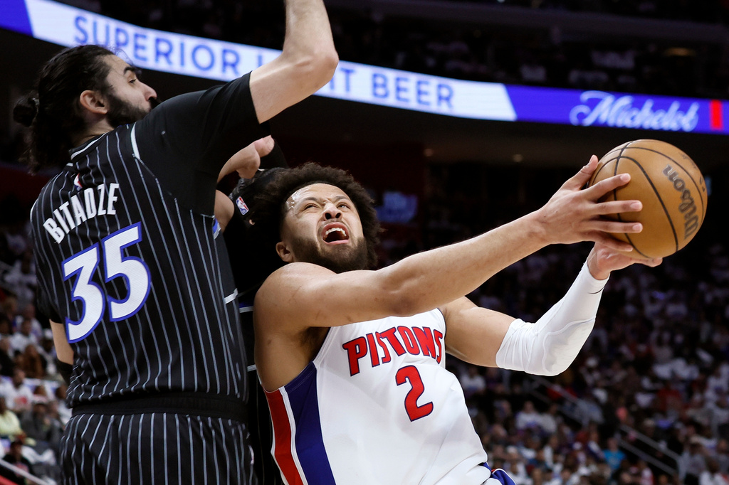 Detroit Pistons guard Cade Cunningham (2) goes to the basket against Orlando Magic center Goga Bitadze (35) during the first half in Game 1 of a first-round NBA basketball playoffs series Sunday, April 19, 2026, in Detroit. (AP Photo/Duane Burleson)
